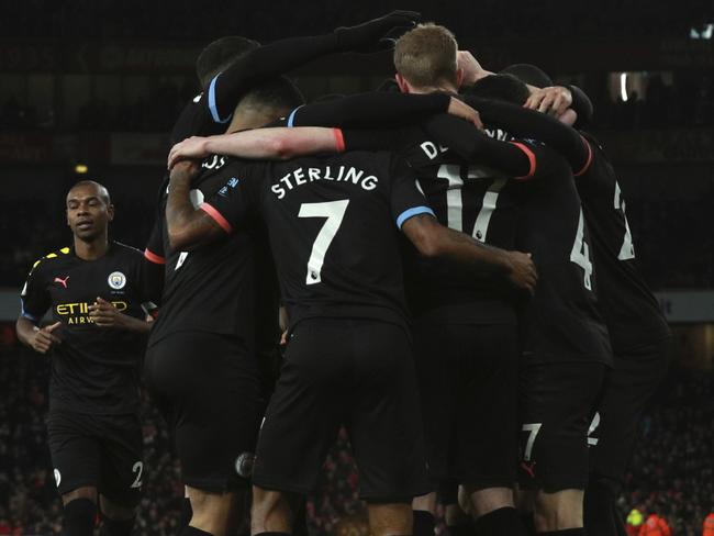 Manchester City players celebrate after Manchester City's Kevin De Bruyne scores his side's third goal during the English Premier League soccer match between Arsenal and Manchester City, at the Emirates Stadium in London, Sunday, Dec. 15, 2019. (AP Photo/Ian Walton)