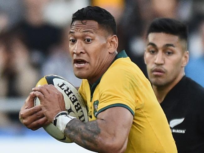 YOKOHAMA, JAPAN - OCTOBER 27: Israel Folau of the Wallabies takes on the defence during the Bledisloe Cup test match between New Zealand All Blacks and Australian Wallabies at Nissan Stadium on October 27, 2018 in Yokohama, Kanagawa, Japan.  (Photo by Matt Roberts/Getty Images)