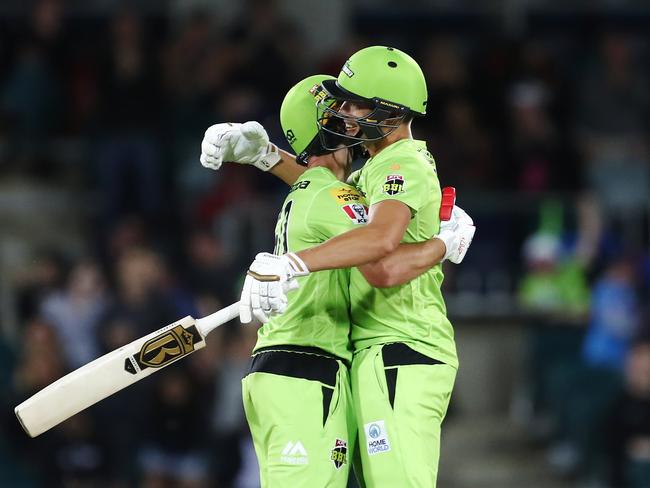 Daniel Sams and Chris Green of the Sydney Thunder celebrate victory over Brisbane Heat during the Big Bash League match on December 14 in Canberra. Picture: Getty