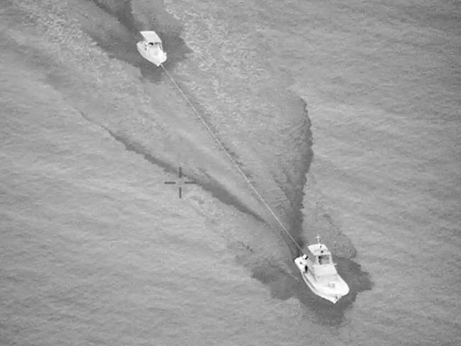 Townsville Volunteer Marine Rescue tows recreational vessel Kaluga Q back to shore. Picture: AMSA.