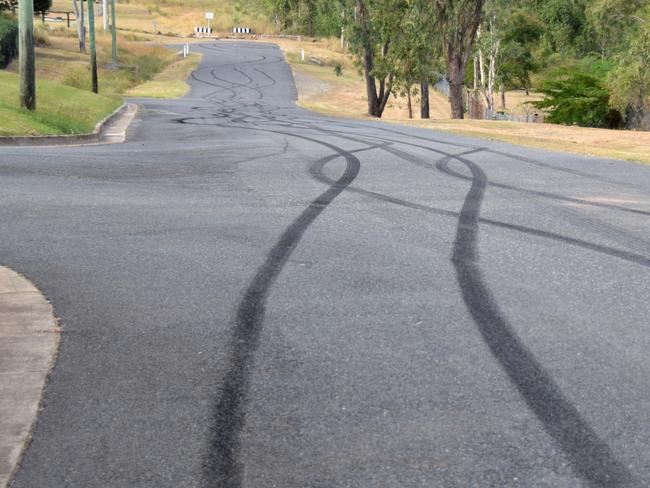 The condition of the road outside Rockhampton Memorial Gardens following mourners' burn outs