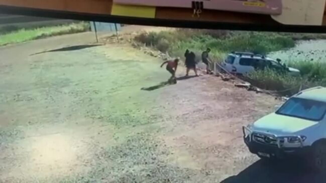 Tourists narrowly avoid croc-tastrophy as car rolls into creek