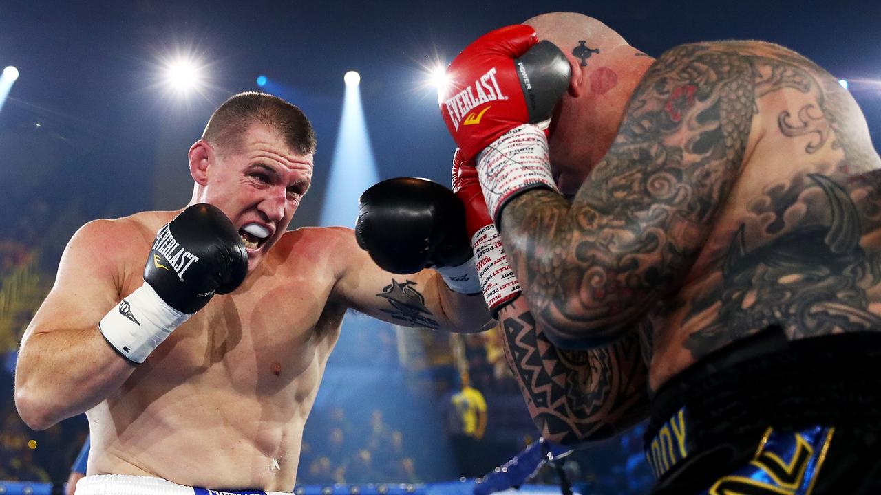 WOLLONGONG, AUSTRALIA - APRIL 21: Paul Gallen punches Lucas Browne during their bout at WIN Entertainment Centre on April 21, 2021 in Wollongong, Australia. (Photo by Mark Metcalfe/Getty Images)