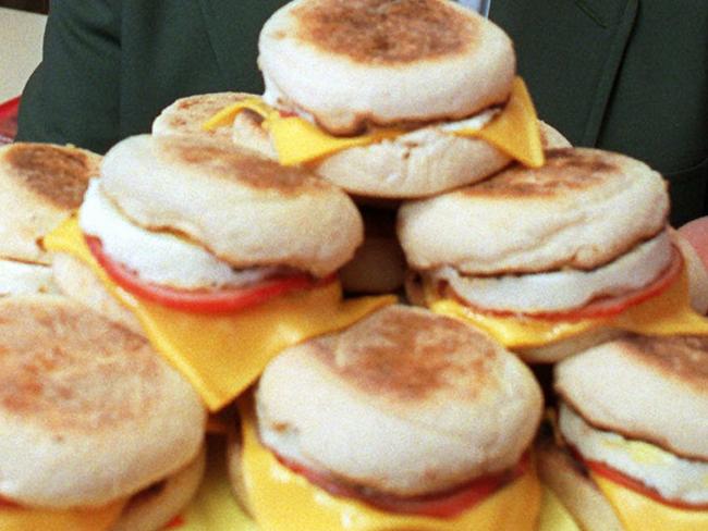 **FILE**Herb Peterson, the creator of the Egg McMuffin, shows off his invention in this April 1997 file photo, at one of his McDonald's franchises in Santa Barbara, Calif. Peterson, 89, died in Santa Barbara on Tuesday. (AP Photo/John Hayes/file)