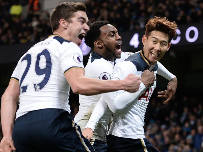 Tottenham Hotspur's South Korean striker Son Heung-Min (R) celebrates with Tottenham Hotspur's English midfielder Harry Winks (L) and Tottenham Hotspur's English defender Danny Rose (C) after scoring their second goal during the English Premier League football match between Manchester City and Tottenham Hotspur at the Etihad Stadium in Manchester, north west England, on January 21, 2017. / AFP PHOTO / Oli SCARFF / RESTRICTED TO EDITORIAL USE. No use with unauthorized audio, video, data, fixture lists, club/league logos or 'live' services. Online in-match use limited to 75 images, no video emulation. No use in betting, games or single club/league/player publications. /