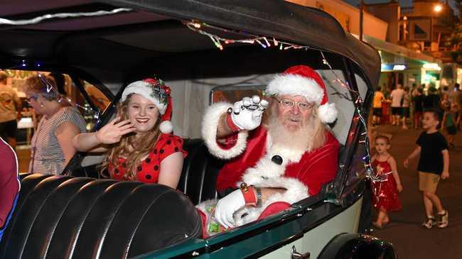 Santa and his helper arrive in style. Picture: Alistair Brightman