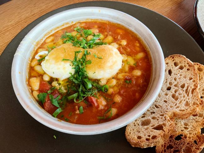 SUNDAY MAIL BRUNCH -  Huevos a la flamenco – tomato braised pork hock, white beans, poached eggs manchego cheese, sourdough at Comida, Hahndorf Picture: Dianne Mattsson