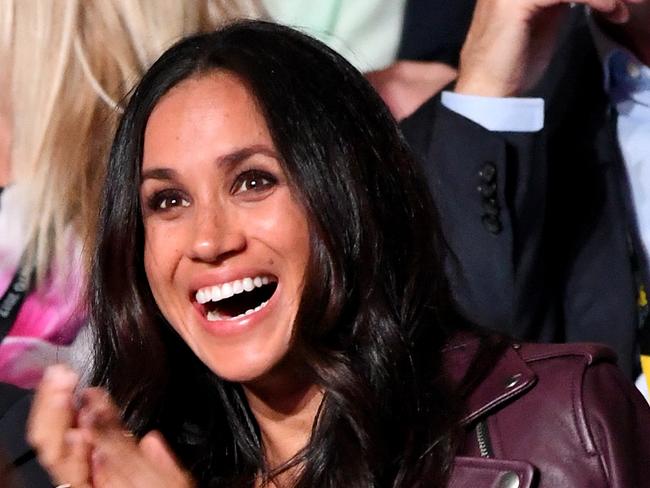 Meghan Markle beams at the Invictus Games, where she made her first appearance with Prince Harry. Picture: Samir Hussein/WireImage