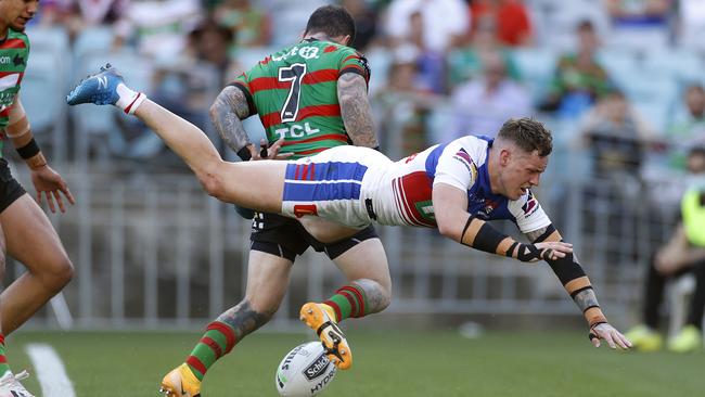 Newcastle's Kurt Mann attempts to knock ball back in during the NRL Elimination Final match between the South Sydney Rabbitohs and Newcastle Knights at ANZ Stadium. Picture. Phil Hillyard