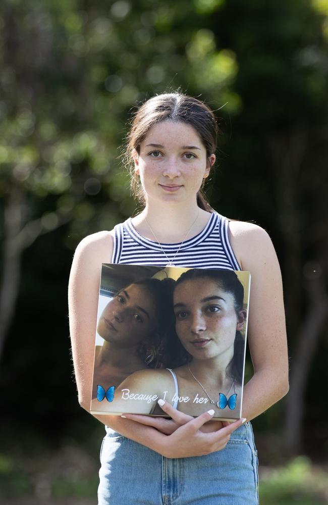 Torryn Squires, 18, with her favourite photograph of her and Alyssa. Picture: David Kelly.