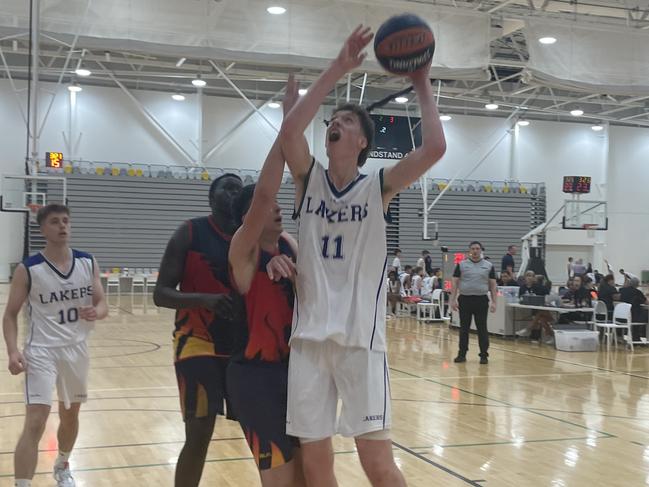 Towering teen Bowyn Beatty in action for Lake Ginninderra College at the Australian Schools Basketball Championships.