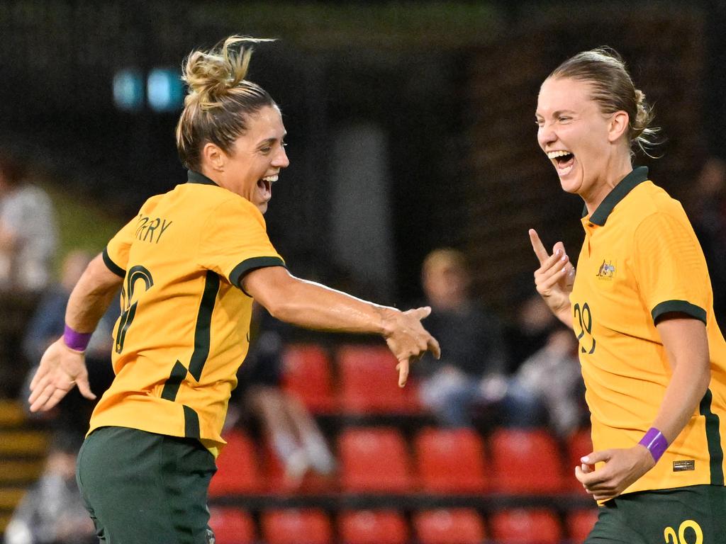 Australian Katrina Gorey (left) celebrates her goal with Claire Hunt.  Photo: Saeed Khan/AFP