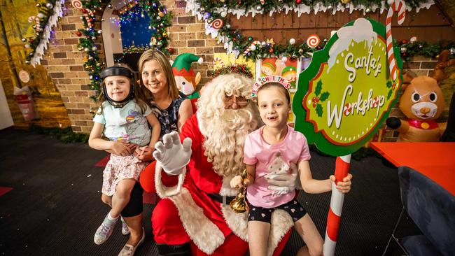 Simone Skinner with daughters Mila, 4, and Ava, 7, with Santa at the Renmark Library. Community spirit in the river region has been praised in the lead up to Christmas. Picture: Tom Huntley