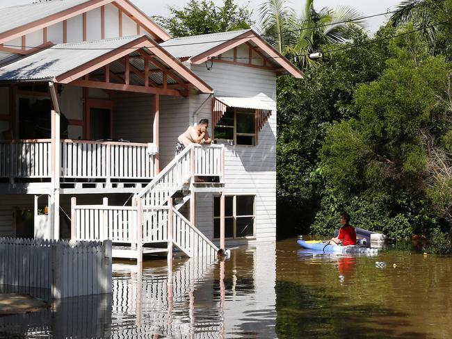 Flooding in Brisbane after heavy rains. A man is stranded in Fenton street in Fairfield. Picture: Tertius Pickard