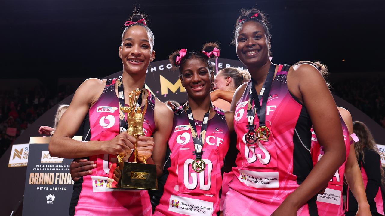 Shamera Sterling-Humphrey, Latanya Wilson and Romelda Aiken-George celebrate winning the Super Netball premiership in 2024. (Photo by Graham Denholm/Getty Images)
