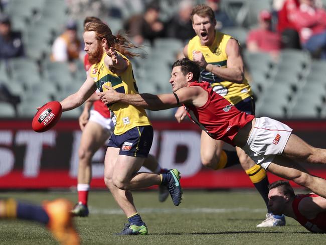 Eagles player Angus Poole is tackled by North’s Aidan Tropiano during Sunday’s controversial preliminary final. Picture SARAH REED