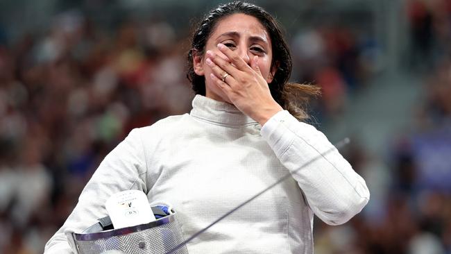 PARIS, FRANCE - JULY 29: Nada Hafez of Team Egypt shows emotion after her victory against Elizabeth Tartakovsky of Team United States (not pictured) in the Fencing Women's Sabre Individual Table of 32 on day three of the Olympic Games Paris 2024 at Grand Palais on July 29, 2024 in Paris, France. (Photo by Al Bello/Getty Images)