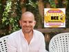 Funny Kid series author and illustrator Matt Stanton with Prime Minister's Spelling Bee logo. For Kids News.