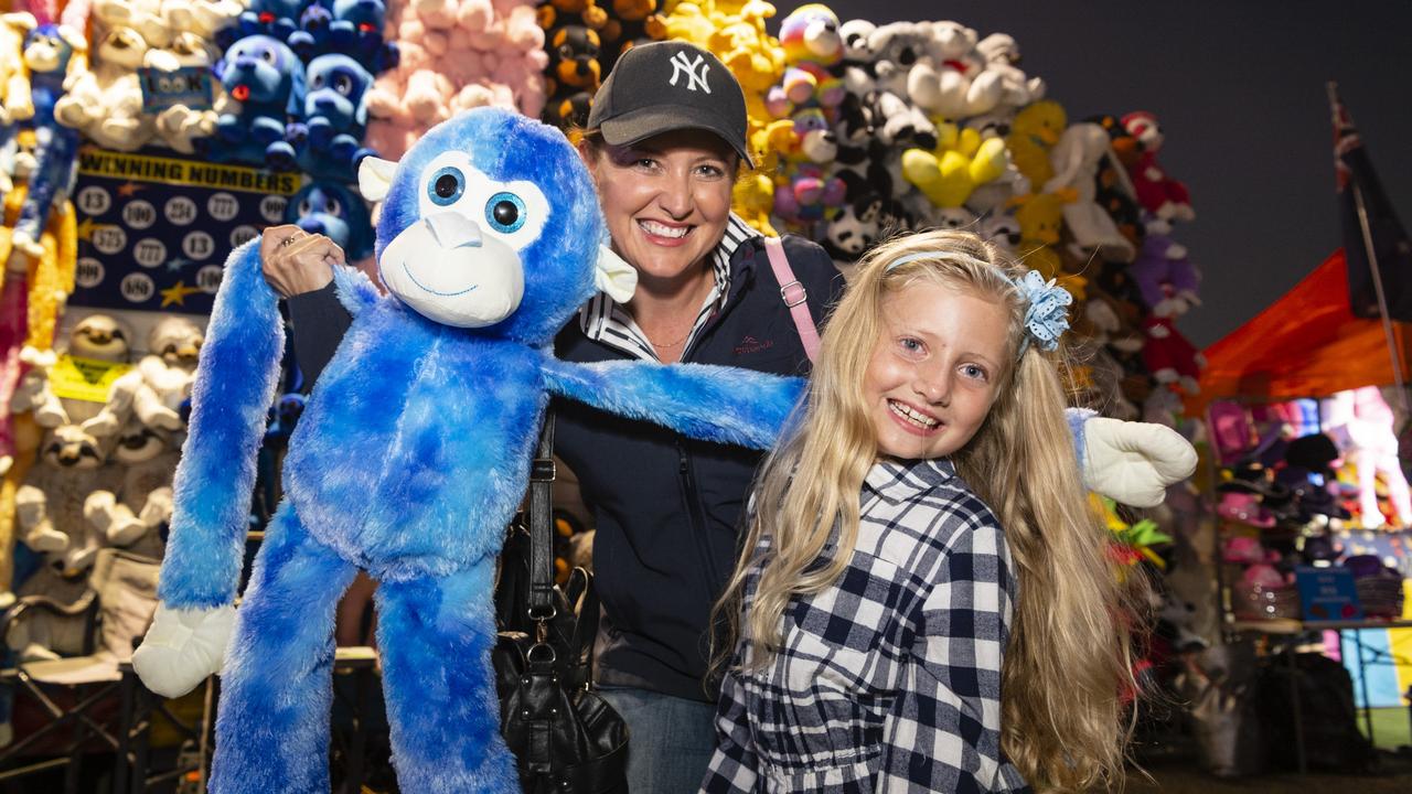 Annabelle Flynn and mum Jessica Flynn with a big soft monkey Annabelle won in sideshow alley at the Toowoomba Royal Show, Thursday, March 30, 2023. Picture: Kevin Farmer