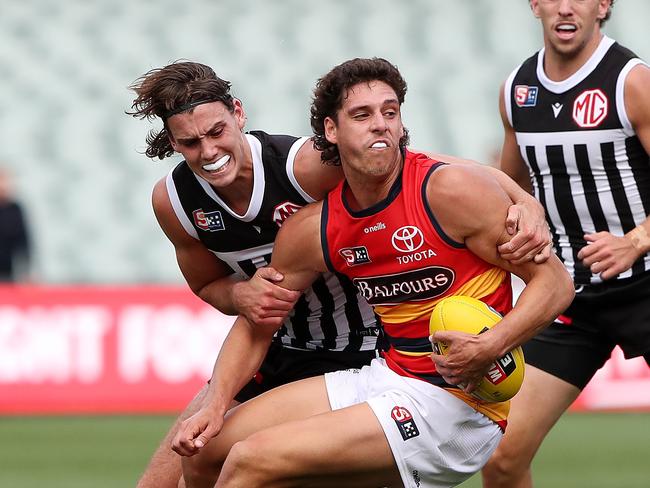 James Borlase of the Adelaide Crows and Ollie Lord of Port Adelaide in the SANFL showdown. Picture: Sarah Reed