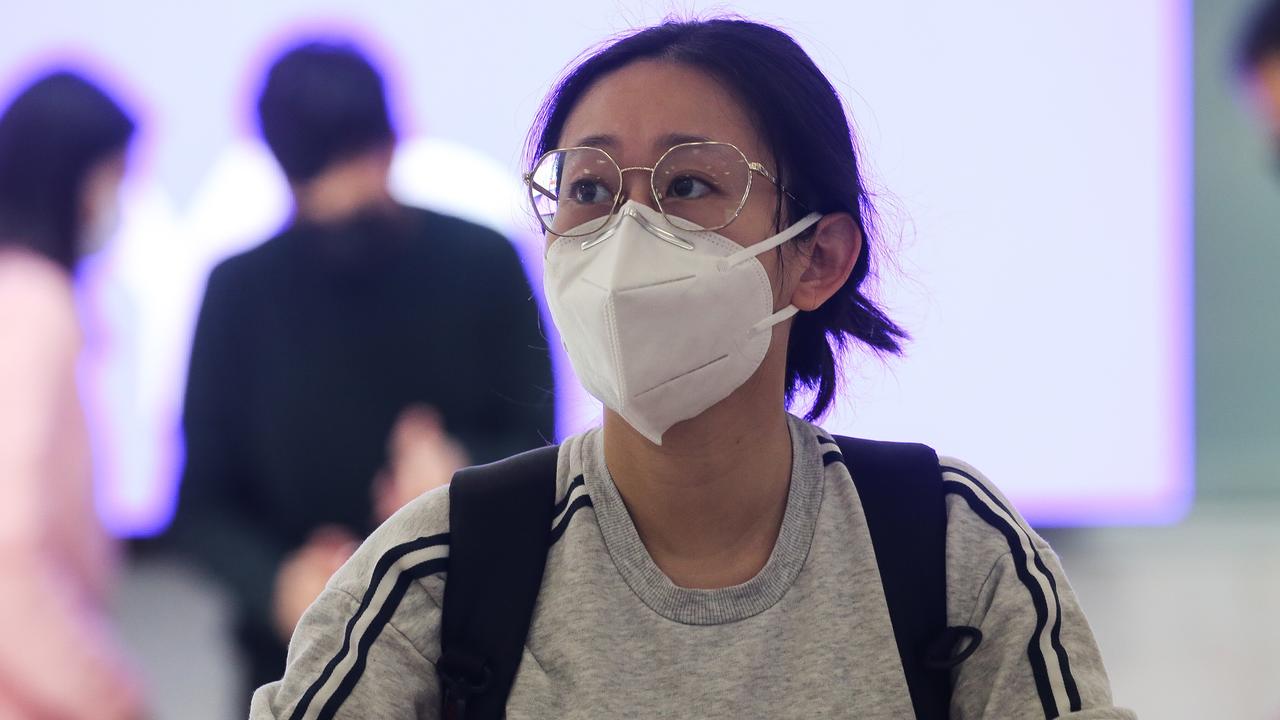 People arrive at Sydney International Airport arrivals terminal from Hong Kong on Monday after Australia set new Covid-19 entry rules for travellers entering the country from China. Picture: NCA Newswire/Gaye Gerard