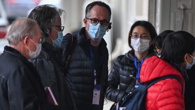 Peter Ben Embarek and other members of the WHO team visit a local community in Wuhan. Picture: AFP