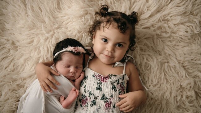 Hazel Davis with her little sister Angel Davis at 9 days old. Picture: Ashlee Crystal Photography