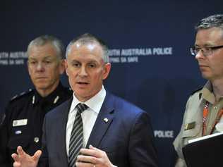 (L-R) Police Commissioner Grant Stevens, SA Premier Jay Weatherill and SA Emergency Chief Chris Beattie speak to the media during a press conference in Adelaide, Wednesday, Sept. 28, 2016. South Australia is coming back to life after severe weather damaged energy infrastructure, shutting down the entire electricity network and plunging the state into darkness. High winds are being blamed for bringing down at least 22 transmission towers in the mid-north on Wednesday with about 80,000 lightning strikes hitting the state, some damaging generation facilities. (AAP Image/David Mariuz) NO ARCHIVING. Picture: DAVID MARIUZ