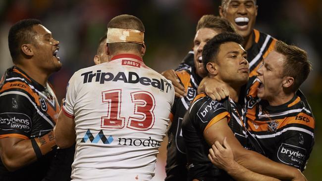 Wests Tigers players congratulate Luciano Leilua (second right) after he scored the winning try. Picture: Getty Images