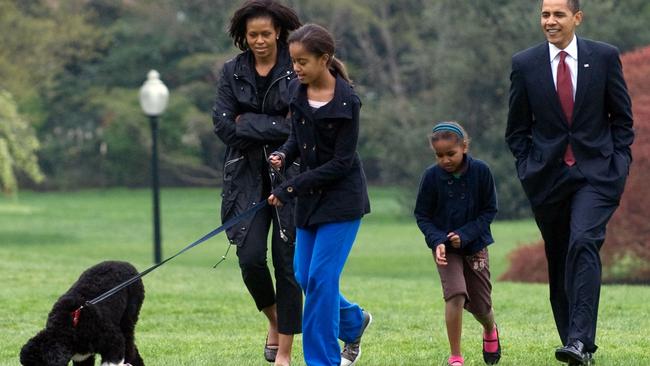 Family walks in 2009. Picture: Saul Loeb / AFP PHOTO