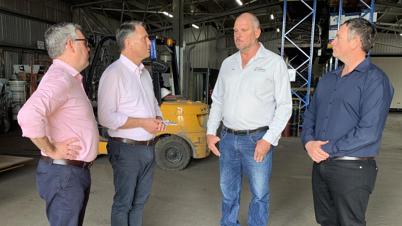 Senator Murray Watt, Labor Party deputy leader Richard Marles, Ausgroup owner Jon Byrnes and Labor’s Dawson candidate Shane Hamilton speaking in Mackay. Picture: Lillian Watkins