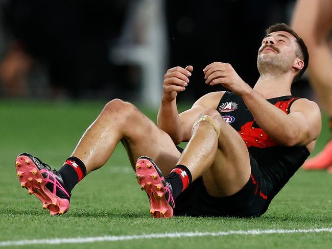 MELBOURNE, AUSTRALIA - APRIL 25: Kyle Langford of the Bombers looks dejected after a draw during the 2024 AFL Round 07 match between the Essendon Bombers and the Collingwood Magpies at the Melbourne Cricket Ground on April 25, 2024 in Melbourne, Australia. (Photo by Michael Willson/AFL Photos via Getty Images)