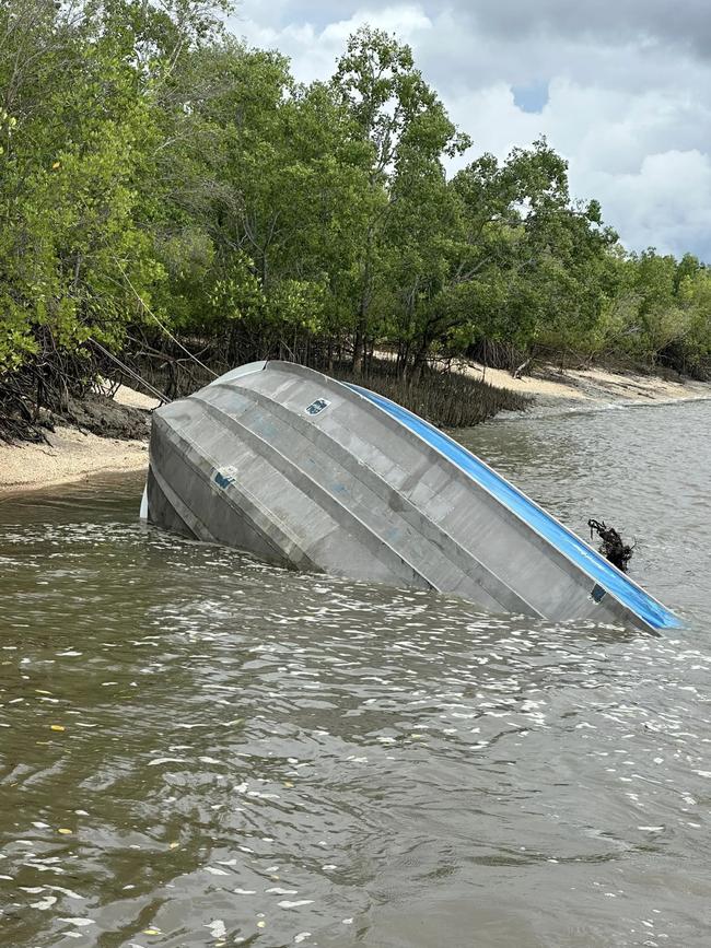 The stricken boat after high tide rolled in next morning.