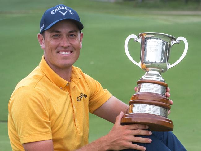 Winner Anthony Quayle proudly shows off the TB Hunter Cup for winning the Queensland Open at Pelican Waters. Photo: David Kapernick