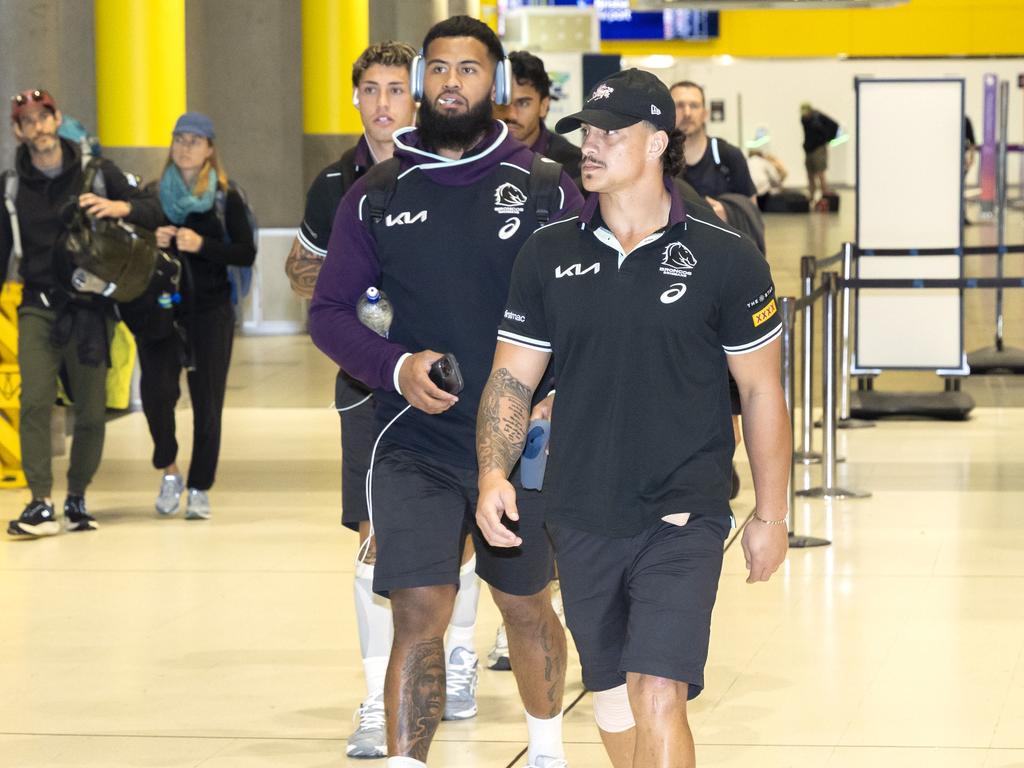 Payne Haas and Kotoni Staggs arrive back at Brisbane Airport after losing to the Rabbitohs. Picture: Richard Walker