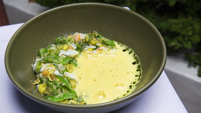 Noosa Spanner Crab with sugar snap peas, egg yolk curry and dill, at Noosa Beach House on Hastings Street. Photo: Lachie Millard 