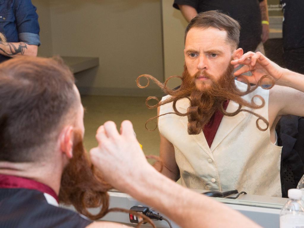 A competitor prepares his beard during the 2017 Remington Beard Boss World Beard and Moustache Championships held at the Long Center for the Performing Arts on September 3, 2017 in Austin, Texas. PIcture: AFP