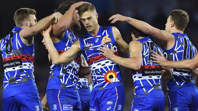 Josh Schache celebrates a goal with teammates.