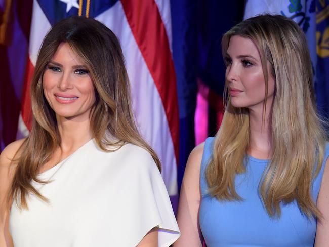 Melania Trump (L) and Ivanka Trump look on as Republican presidential elect Donald Trump speaks during election night at the New York Hilton Midtown in New York on November 9, 2016.  / AFP PHOTO / JIM WATSON