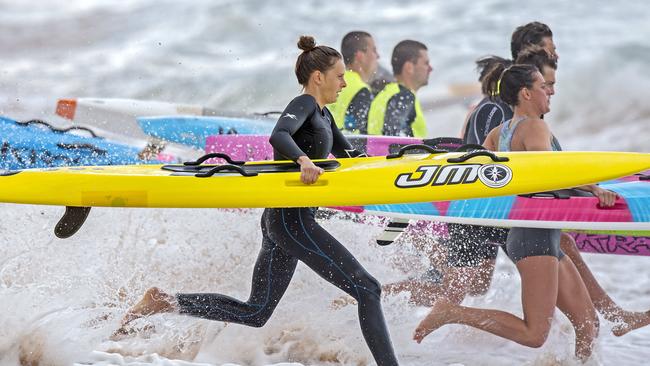 Ironwoman Lizzie Welborn (in black) training with clubmates at Newport.