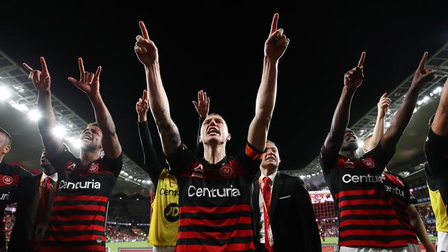 Mitchell Duke of the Wanderers leads his team mates in celebrations following victory over Sydney FC at Bankwest Stadium. Picture: AAP