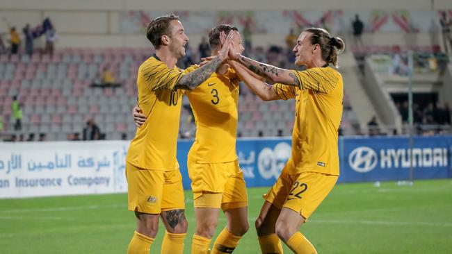 The Socceroos celebrate Taggart’s first-half goal. Picture: AFP