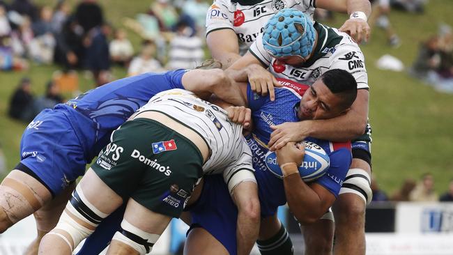 Manly prop Gunnz Fuavao cops some tough Warringah Rats defence. Picture: Karen  Watson