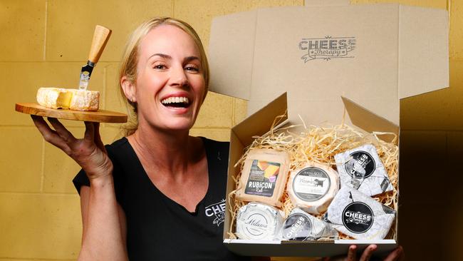 Cheese Therapy owner Helen Shadforth with some offerings from the subscription service, which took off so fast Ms Shadforth had to open a bigger warehouse and employ more staff. Picture: Lachie Millard