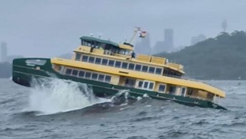 An Emerald Class 2 ferry, used on the Manly to Circular Quay route, battles huge swells near Sydney Heads during heavy sea trials on Sydney Harbour on Thursday. Picture: Mark Crawley