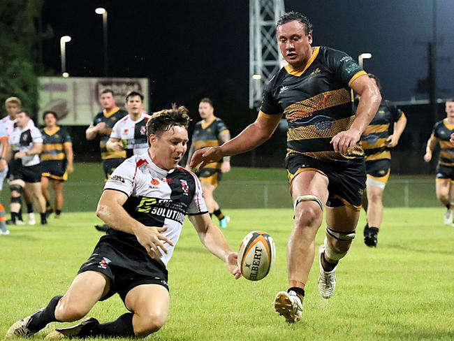 Robert Butcher in the processing of fielding the loose ball while under pressure. Picture: From The Sideline Sports Photography.