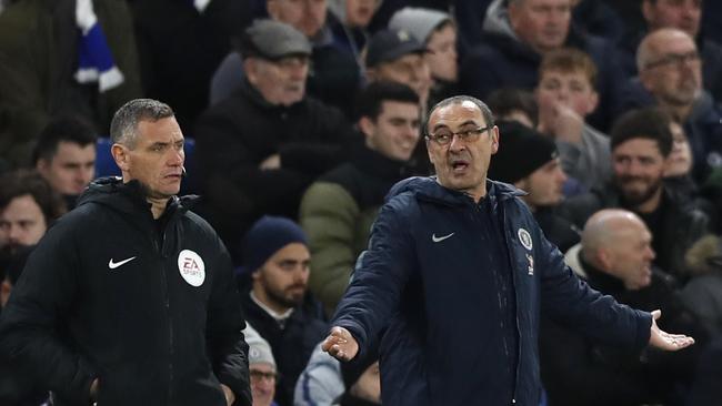 Chelsea head coach Maurizio Sarri gestures when looking at the fourth official during the English FA Cup fifth round soccer match between Chelsea and Manchester United at Stamford Bridge stadium in London, Monday, Feb. 18, 2019. (AP Photo/Alastair Grant)