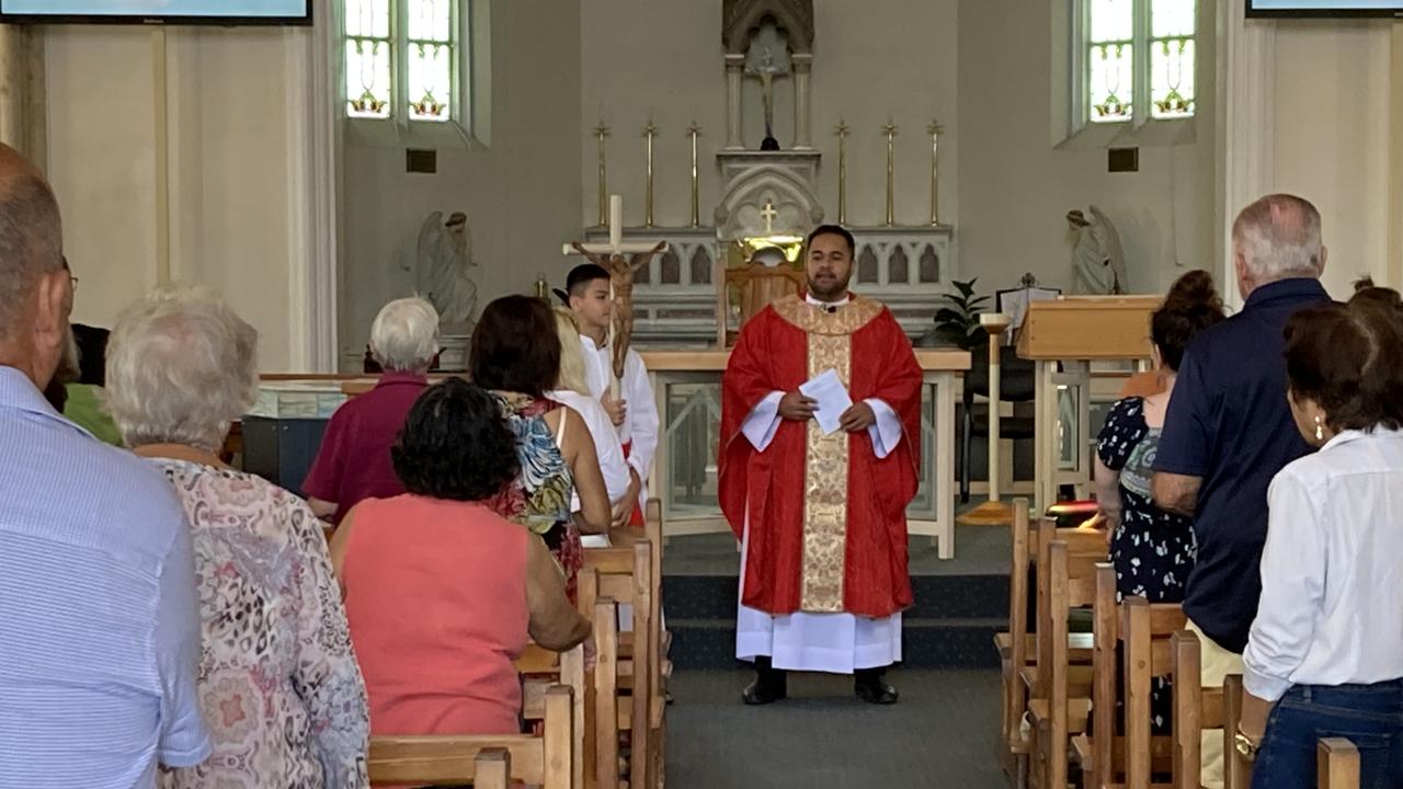 Father William leads Gympie’s St Patrick's Church through the Stations of the Cross on Good Friday morning.