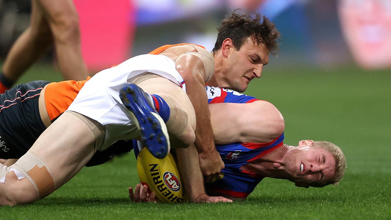 Giants ruckman Braydon Preuss was suspended for one match for this tackle on Bulldogs counterpart Tim English Picture: Phil Hillyard