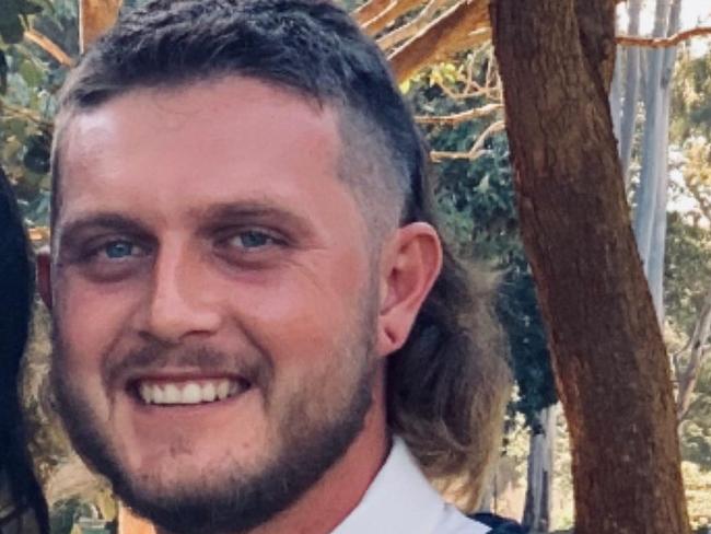 Cody Liam Saran was sentenced to nine months' jail for assault occasioning bodily harm. (Man on the right hand side wearing suit and white shirt with epic mullet, blue tie and white flowers on vest.)